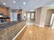 Spacious kitchen with black countertops, stainless-steel appliances, and an island bar at 1072 Ceasars Ct, Mount Dora, FL 32757