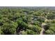 Overhead photograph showing a dense forest of trees that surrounds the residence providing privacy and shade at 1081 Torchwood Dr, Deland, FL 32724