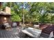 Back deck with outdoor seating and a view of the fenced backyard at 1081 Torchwood Dr, Deland, FL 32724