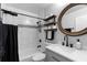 Updated bathroom features a shower-tub combo, modern vanity, and stylish decorative shelves at 1081 Torchwood Dr, Deland, FL 32724