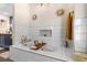 Bright bathroom featuring a tiled bathtub, gold fixtures, and decor that create a spa like retreat at 1081 Torchwood Dr, Deland, FL 32724