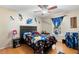 Bright bedroom with ceiling fan, showcasing fun decor and a cozy atmosphere at 1081 Torchwood Dr, Deland, FL 32724