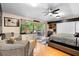 Bright bedroom with sliding glass doors, a ceiling fan, and ample natural light at 1081 Torchwood Dr, Deland, FL 32724