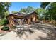 Brick home with spacious driveway, two-car garage, and a basketball court at 1081 Torchwood Dr, Deland, FL 32724