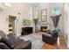 Cozy living room featuring a fireplace, high ceilings, and natural light at 1081 Torchwood Dr, Deland, FL 32724
