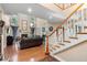 Open living room with high ceilings, fireplace, and large windows at 1081 Torchwood Dr, Deland, FL 32724