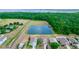 Overhead of houses near a lake and expansive forested area at 112 Coral Reef Ct, Sanford, FL 32771