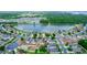 Community aerial view, showcasing the layout of homes and a central lake at 112 Coral Reef Ct, Sanford, FL 32771