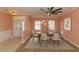 Inviting dining room with a modern chandelier, seating for six, and easy access to the entry at 112 Coral Reef Ct, Sanford, FL 32771