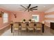 Formal dining room with a long table, seating for eight, and elegant striped wall accent at 112 Coral Reef Ct, Sanford, FL 32771
