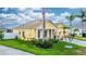 Charming single-story home with lush landscaping, a well-manicured lawn, and covered entryway at 112 Coral Reef Ct, Sanford, FL 32771