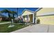 Inviting home exterior with manicured landscaping, flowering plants, and a welcoming entrance at 112 Coral Reef Ct, Sanford, FL 32771
