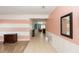 Bright hallway with tile floors, decorative wall accents, and an open layout to the living areas at 112 Coral Reef Ct, Sanford, FL 32771