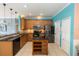 Well-lit kitchen with stainless steel appliances, an island, and ample cabinet space at 112 Coral Reef Ct, Sanford, FL 32771