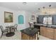 Open-concept kitchen with a center island, stainless steel appliances, and a breakfast nook at 112 Coral Reef Ct, Sanford, FL 32771