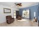 Cozy living area with tile floors, comfortable seating, and a view of the outdoor pool at 112 Coral Reef Ct, Sanford, FL 32771