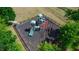 Overhead view of community playground surrounded by a black metal fence and padded ground cover at 112 Coral Reef Ct, Sanford, FL 32771