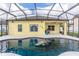 A screened-in pool and patio area features a full view of the back of the home at 112 Coral Reef Ct, Sanford, FL 32771