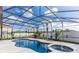 Gorgeous screened-in pool with a jacuzzi and beautiful landscaping at 112 Coral Reef Ct, Sanford, FL 32771