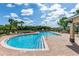 A beautifully designed community pool featuring a classic red brick deck and refreshing blue water at 112 Coral Reef Ct, Sanford, FL 32771