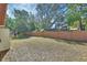 Spacious backyard featuring green grass and wooden fence at 1128 Heidi Ct, Deland, FL 32720