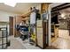 Basement storage room with shelving and adjacent finished room at 1128 Heidi Ct, Deland, FL 32720