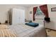 Bedroom featuring a double bed, carpet, and natural light from the window at 1128 Heidi Ct, Deland, FL 32720