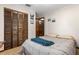 Bedroom featuring a double bed, carpet, and wooden closet doors at 1128 Heidi Ct, Deland, FL 32720
