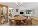 Dining area featuring cozy seating, chandelier, and connections to adjacent spaces at 1128 Heidi Ct, Deland, FL 32720