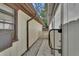 Exterior view of side yard with connecting walkways and building access at 1128 Heidi Ct, Deland, FL 32720