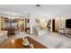 Open concept living room adjacent to dining area, perfect for entertaining at 1128 Heidi Ct, Deland, FL 32720