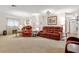 Inviting living room features carpet, soft lighting, and comfortable seating at 1128 Heidi Ct, Deland, FL 32720
