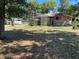 Large backyard with a screen enclosed lanai providing ideal outdoor living at 1179 Heidi Ct, Deland, FL 32720