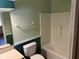 This bathroom features a combined shower-tub, toilet, and a neutral color palette at 1179 Heidi Ct, Deland, FL 32720
