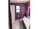 This bathroom features a combined shower-tub, toilet, and a vibrant color palette at 1179 Heidi Ct, Deland, FL 32720