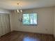 The Dining room offers wood flooring, natural light, and closet space at 1179 Heidi Ct, Deland, FL 32720