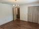 The Dining room offers wood flooring and a chandelier for an elegant touch at 1179 Heidi Ct, Deland, FL 32720