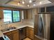 Well-lit kitchen featuring stainless steel appliances and functional layout at 1179 Heidi Ct, Deland, FL 32720