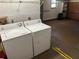 Convenient laundry space with modern washer and dryer, along with adjacent storage options at 1179 Heidi Ct, Deland, FL 32720