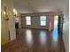Inviting living room featuring hardwood floors and a cozy fireplace at 1179 Heidi Ct, Deland, FL 32720