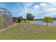 Well-manicured lawn extending to a tranquil lake, offering picturesque views at 1188 Eggleston Dr, Deland, FL 32724
