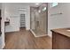 Stylish bathroom featuring a glass shower stall with ceramic tiles and wood-style flooring at 1188 Eggleston Dr, Deland, FL 32724