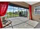 Relaxing screened patio featuring a stone fountain, brick pavers, and a view of the backyard at 1188 Eggleston Dr, Deland, FL 32724
