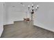 Bright dining room with wood-look tile floors and a decorative chandelier at 1188 Eggleston Dr, Deland, FL 32724