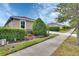 Inviting single-story home with manicured landscaping, lush green hedges, and a neatly paved sidewalk at 1188 Eggleston Dr, Deland, FL 32724