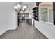 Open-concept kitchen with granite countertops, stone backsplash, stainless appliances, and wood-look floors at 1188 Eggleston Dr, Deland, FL 32724