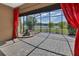 Charming lanai with brick pavers and a serene fountain overlooking the lake at 1188 Eggleston Dr, Deland, FL 32724