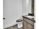 Elegant powder room with dark wood cabinets, granite countertop, and stylish fixtures at 1188 Eggleston Dr, Deland, FL 32724