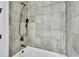 Stylish shower with textured gray tiling, matte black fixtures, and a relaxing bathing experience at 1188 Eggleston Dr, Deland, FL 32724