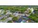 Residential neighborhood with tree-lined streets, well-maintained homes, swimming pools, and lush landscaping at 1202 Anderson St, Deltona, FL 32725
